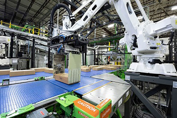 Smart case handling robots are part of Symbotic's technology, seen here on the inbound side of the process. The GreenBox JV with SoftBank is seen as a way to bring the benefits of the technology to a broader customer universe.